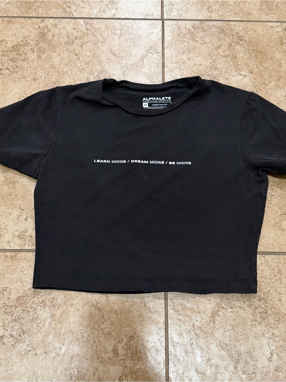 Alphalete women’s Black Cropped Tee - Learn More Print